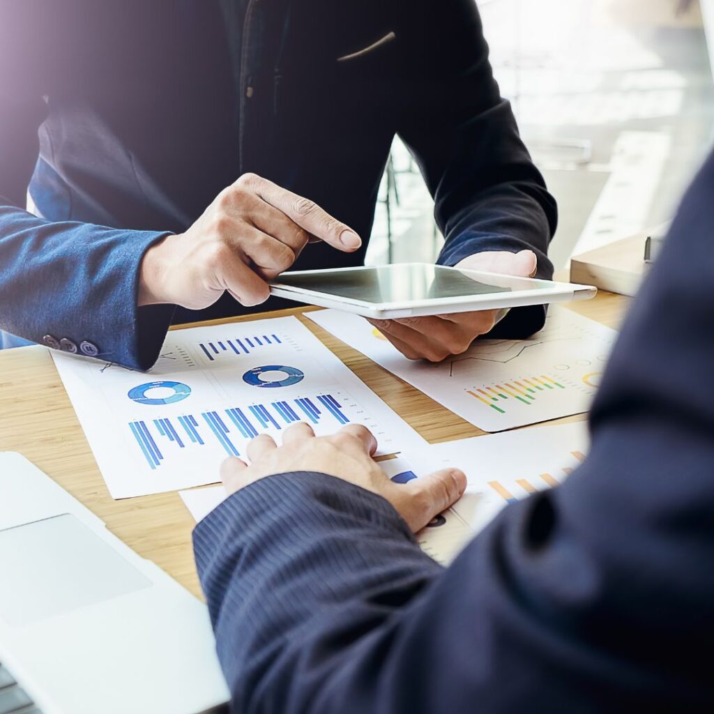 two people reviewing investment data