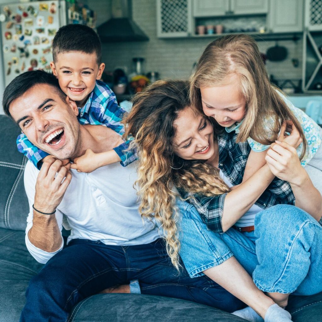 Family of Four Hugging