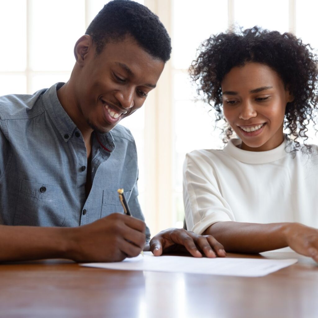 Couple Signing a Document