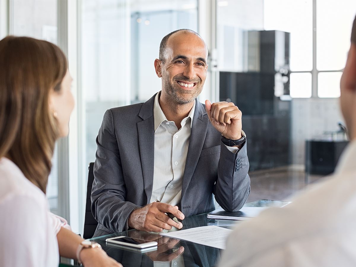 Smiling lawyer communicating with clients